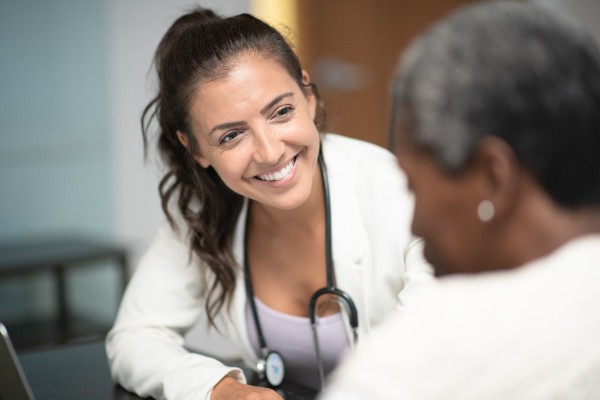 A doctor speaking to a patient